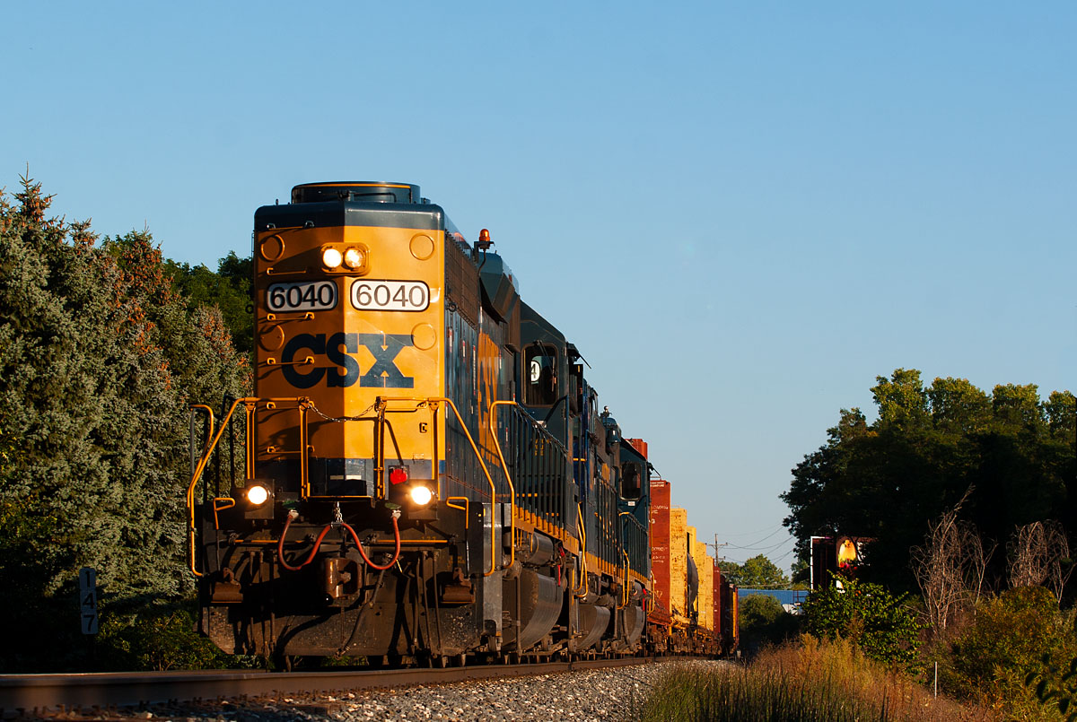 CSXT 6040
D70723 died out near Lansing, so a recrew called D90724 brought the train of mainly empty lumber cars back to Grand Rapids.  Seen from behind Riders hobby shop on 9/24/13.
