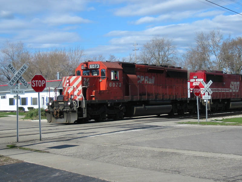 CP 6073 & Sooline 6055
CP #6073 with Soo #6055 heads west past a shopping plaza in Grandville. 04/02/04 
