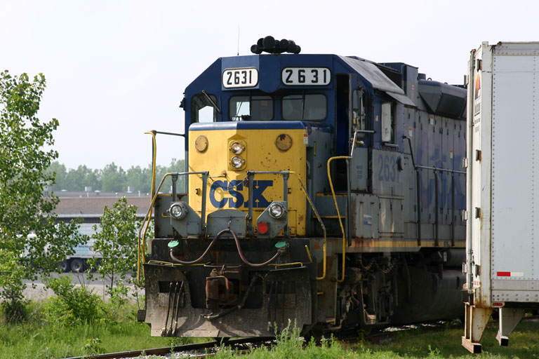 CSX 2631
CSX #2631 peaks its' head out as it backs into the spur in Grandville. 05/27/04 
