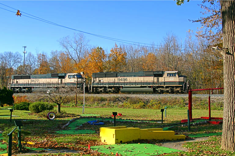 BNSF 9496 & BNSF 9677
BNSF 9496 & 9677 lead an eastbound lite engine movement past a minigolf course in Grandville. These engines dropped off a string of loaded coal hoppers at West Olive. 
