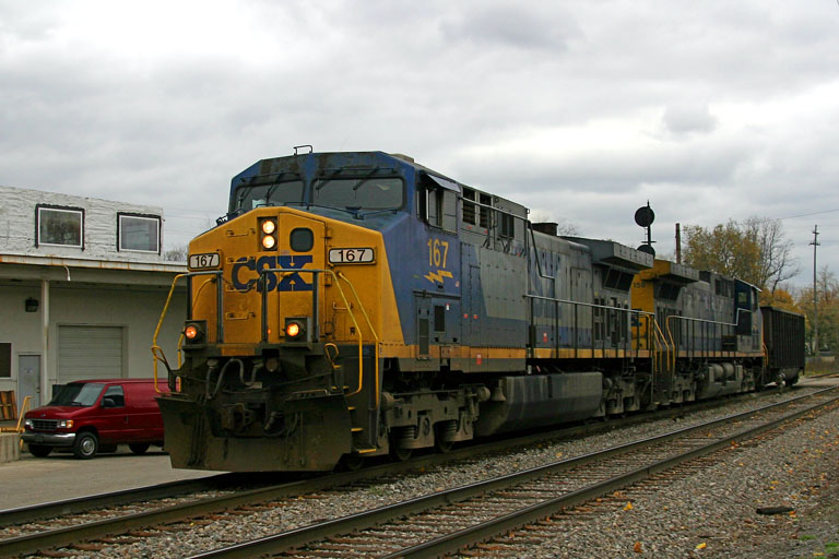 CSX 167 & CSX 154
CSX 167 & CSX 154 head west through Grandville after having to wait for an eastbound CP train, lead by two Soo engines. This train is bringing a single empty coal hopper to go to West Olive possibly for repairs, then to pick up the rest of the empties at West Olive.   2004
