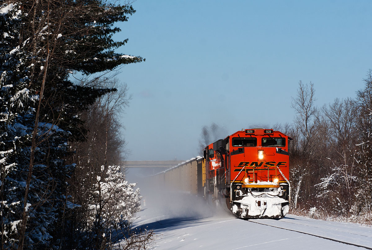 BNSF 9211
Got a heads up from Tlout that E949 was going by his place on the north side of Holland. With lots of snow the day before and a gorgeous sunny day, had to head trackside during lunch to nab a "westbound" on a rare sunny Michigan winter day.  01/23/14
