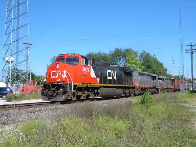 CN 2609, GCFX 6067 & GCFX 6064
CN general freight lead by CN 2609 with GCFX 6067 and 6064 bringing this long train by on the first sunny day in quite some time in Michigan. 3:45pm on 09/02/03 
