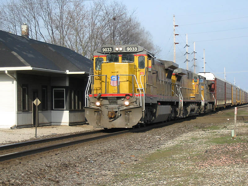 UP 9033
UP #9033 leads this trio of UP power on a westbound CN train over the NS/CN diamond. Glad I was out watching this with Kevortian than doing taxes like some others. 04/15/04 
