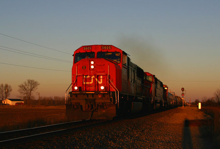 CN 5605 sunset
CN 5605 leads a trio of engines into the setting sun at 10th St in Schoolcraft. 11/13/04 
