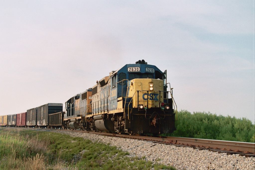 CSX GP38-2 #2630
Number 2630 and a former Conrail sister (#2794) haul 45 cars south from Manistee toward Walhalla Jct on August 2, 2005.  This train is seen passing through East Lake, MI just across the lake from Manistee.  NN photo
Keywords: D712 CSX CSXT 2630 GP38-2 Manistee East Lake Baldwin