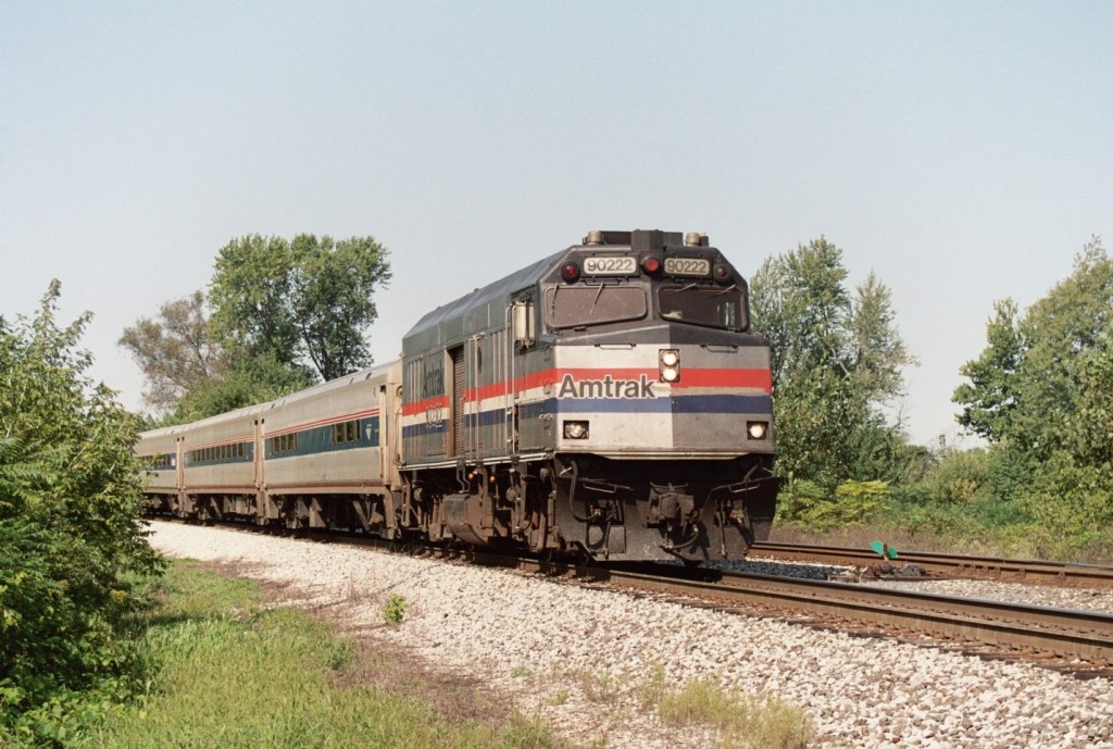 Amtrak NPCU #90222
Amtrak train 350 accellerates east on Track 2 near the View Crossover in Kalamazoo.  They have just crossed the Kalamazoo River Bridge and in a moment will be passing the switches at West Botsford.  Amtrak 90222 was repainted during late 2005, only to have some of its white stripes peel away.  September 8, 2006.
Keywords: Amtrak NPCU F40 cab 90222 350 Wolverine Horizon View Crossover Kalamazoo Phase III