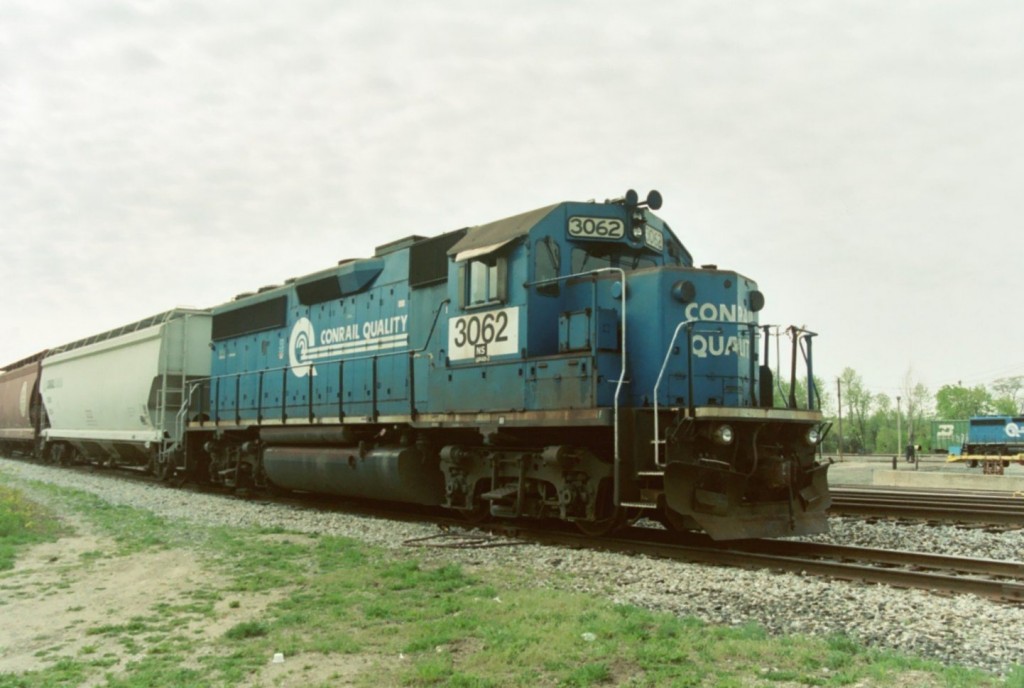 Conrail GP40-2 #3062
Visiting Conrail Quality GP40-2 #3062 is on the head end of NS local job B-57, on the North Pass in Kalamazoo.  B-57 is the night turn from Kalamazoo's Botsford Yard to switch at Battle Creek and return.  When the crew is short on time, they will pull their train onto the North Pass rather than back it into the yard.  A day crew will then come on duty and take their train into the yard to break it up.  Lately (May 06), they have been running with an engine on each end of this train.  May 5, 2006.
Keywords: Conrail Quality CR GP40-2 3062 North Pass Kalamazoo Botsford Yard B-57 Battle Creek local turn