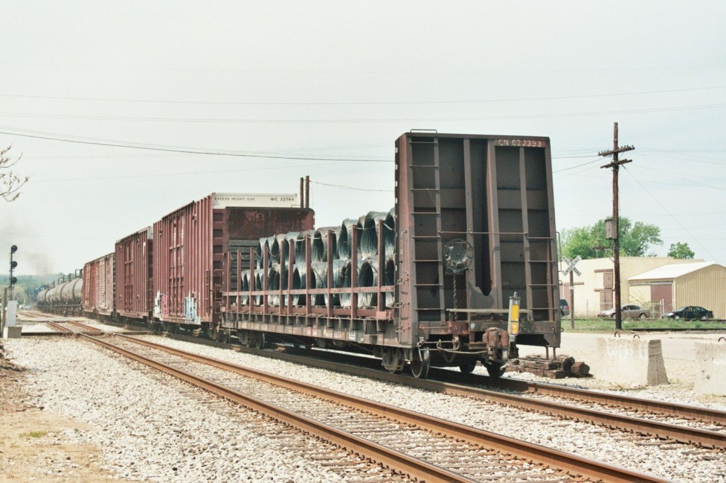 B-1-G with wire car
NS local job B-1-G heads west over the diamonds at BO Interlocking in Kalamazoo with a typical consist for Lawton and Dowagiac, and the first car of coiled wire for National Standard in Niles. This plant has recently built a long spur into their plan and apparently will generate quite a bit of traffic for this westbound on Tuesdays & Thurday local. May 8, 2007. 
Keywords: B-1-G B1G Kalamazoo local wire BO Interlocking junction Niles tower