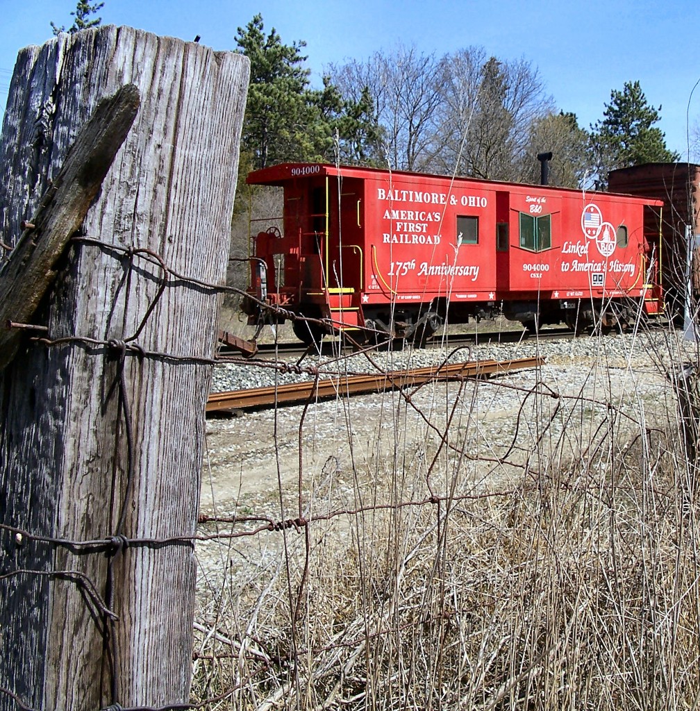 B&O Caboose with C&O Relics
The B&O aniversy caboose as seen from a ancient fence in Island Lake State Park.
4/16/2008
D008-16
Island Lake State Park Green Oak/Brighton CH42.3
