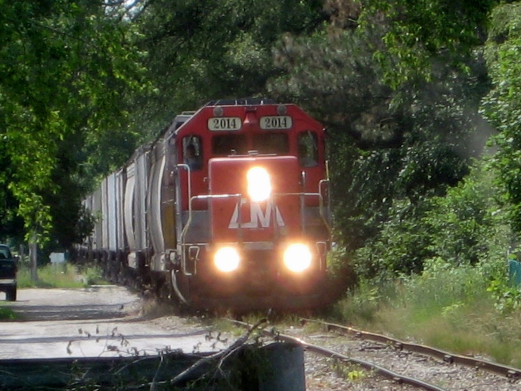 Approaching 770
Our 770 job has just crossed M13 or Euclid Ave. and is now on the approach through the neighborhoods of NW Bay City to Alp St. On this part of the Midland Sub the tracks pass just a few feet from peoples houses giving a very small ROW.
Keywords: HESR CMGN 770 Bay City MI