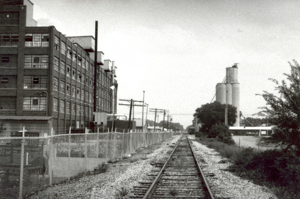 Ionia,MI GenCorp factory on GTW
  This was shot at the back side of the GenCorp (General Tire Corp.) factory in Ionia,MI on the GTW in 1986. The plant made fiberglass body panels for the auto industry. It closed in  about 1994, and was soon leveled.
Keywords: Ionia,MI GTW