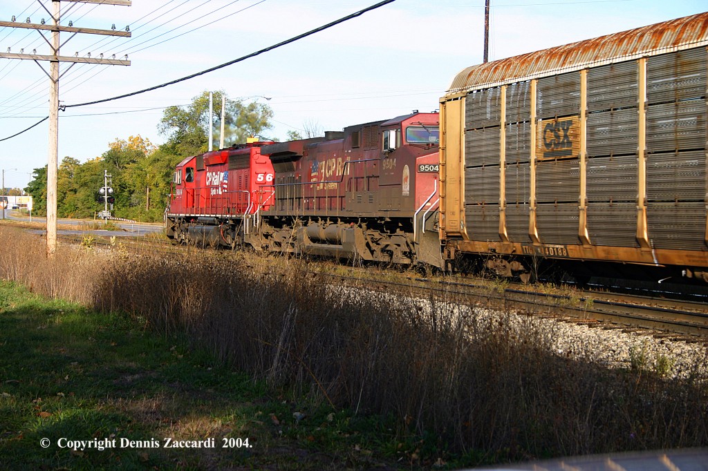 Autorack Train
An EB Autorack Train led by CP 5664 & 9504 awaits X205 in the siding at Ivanrest Road on October 11, 2004.
Keywords: Wyoming Yard, X205, Autorack, Canadian Pacific, Ivanrest Rd., Chicago Drive