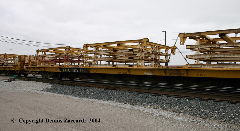 Truck Frame Flat?
I was told that these Flat Cars with the hold downs are used to transport Truck Frames to the Automotive Plants?  Photographed at CSX Wyoming Yard (Judd Street) on October 17, 2004.
Keywords: Wyoming Yard, Grand Rapids, Michigan, Truck Frames