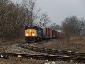 GDLK comes north past Arvco Containers, as viewed from the new parking lot.  I always like how this train tends to be so boxcar-heavy.