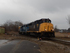 Wide angle showing just how close the new pavement comes to the rails, with the switch into the Junkyard Spur.