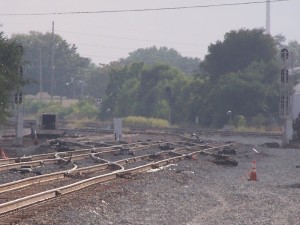 Looking west through the plant. North freight continues with a &quot;kink&quot; beyond the signal. The old South Freight ends where the old signal was located. The new South Freight signal (10E) is to the left through the turnouts.