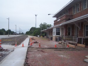 A new ramp to the building and sidewalk connection under construction.