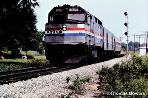 Southbound at (CPRiver) Junction of the Kalamazoo Branch and the Air line to Jackson. Three Rivers, Mi. Amtrak #319 on 8-1983