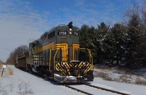 As the blue sky appeared, we caught the southbound Jackson and Lansing train at the Willoughby Road crossing, beside some snowy pines.