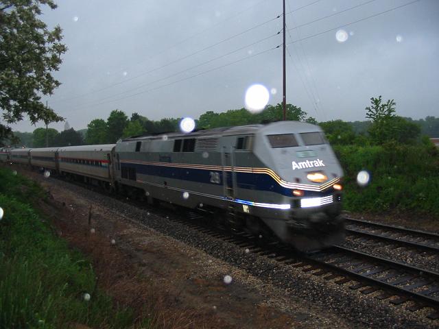 Amtrak 28
Amtrak #28 whizzing by Lawson Ice Arena at WMU in the rain @ 7:33pm on 06/04/03 
