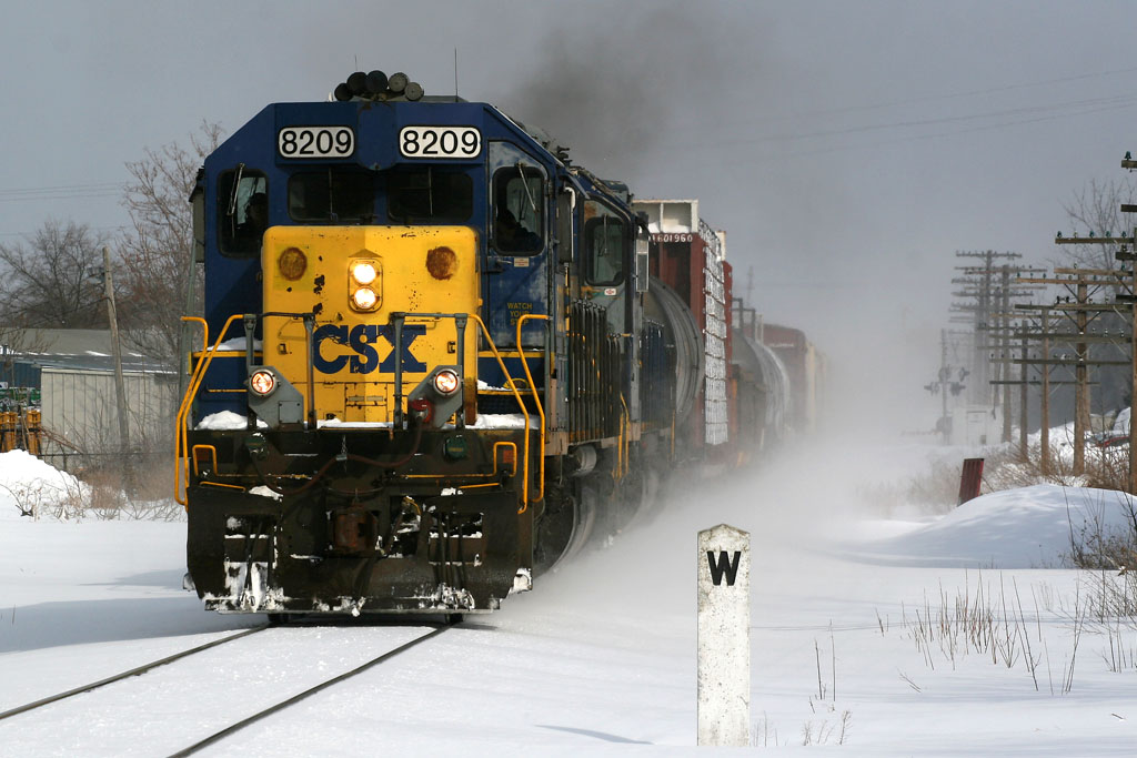 CSXT 8209
CSXT 8209 comes onto the single track in Grandville, seen kickin up snow at Broadway Ave.  03/03/07
