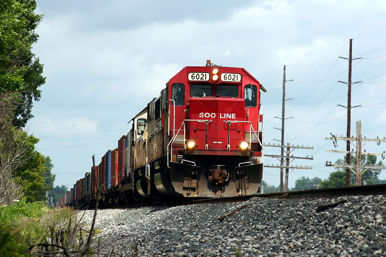 Sooline 6021
SOO #6021 leads a paired CP consist past Sunrise Park in Hudsonville. 07/14/04 
