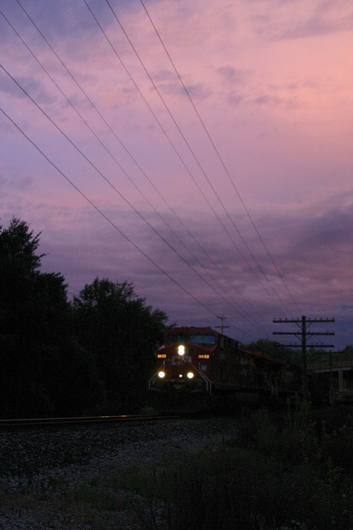 CP 8652
CP #8652 leads X503 westbound past Baldwin Rd in Jenison. My brother was just leaving, I looked outside and saw the sunset. Heard X503 approaching Ivanrest.. headed out quickly to catch the clouds. 08/25/04 
