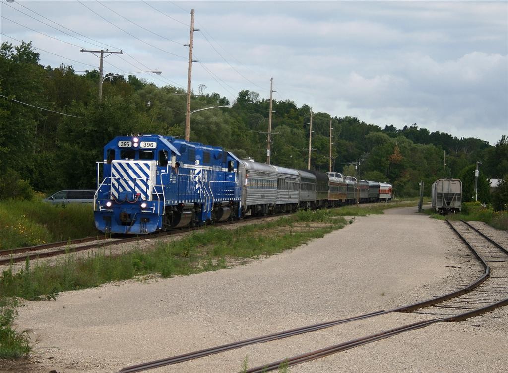 Northern Arrow at Petoskey
Passing plastic cars for Petoskey Plastics, the southbound Northern Arrow is departing Petoskey behing GP38-2"s 396-398.
August 7th 2012.
