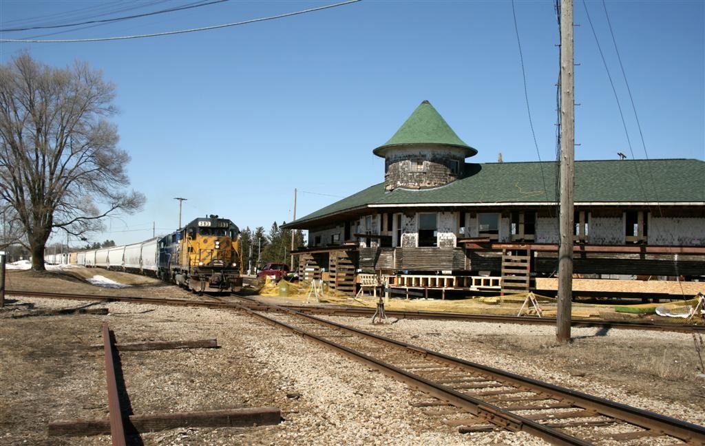2 April 2014 Clare MI
GP35's 393-392roll past the depot at Clare MI on a sunny April 2 2014 day. Moving crews are preparing the depot to be relocated further from the tracks.
