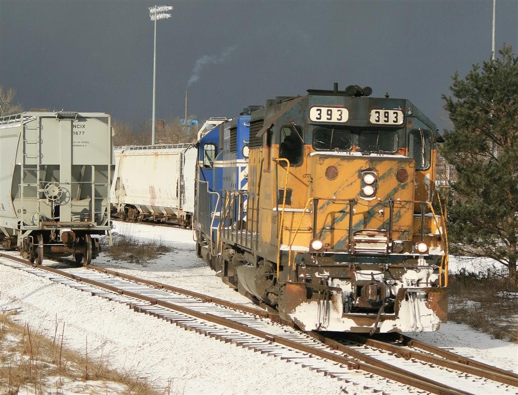 GLC 30 December 2014
Working at Petoskey, GP35's 393 and 392 are seen switching out empty and loaded covered hoppers for the transload to Petoskey Plastics.
