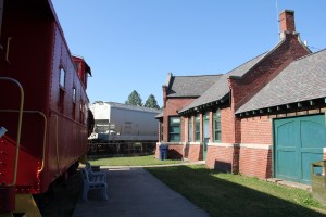 View looking south down the GR&amp;I platform at Vicksburg looking toward a passing CN train.