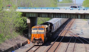 NS' interstate heritage unit ducks under an overpass just west of the Toledo Amtrak station.